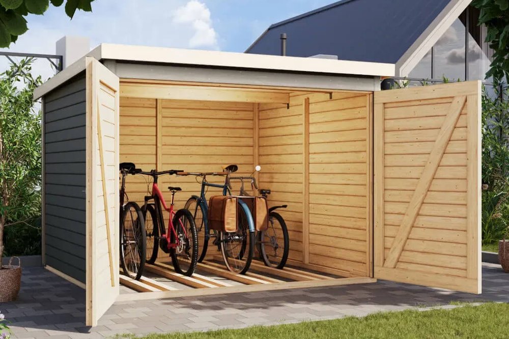 Abri à vélos ouvert installé dans le jardin d'une maison individuelle à côté d'un local fermé