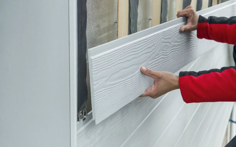 Coupe technique d'un système de bardage rapporté ventilé montrant le mur support, l'isolation, le pare-pluie, la lame d'air et le bardage