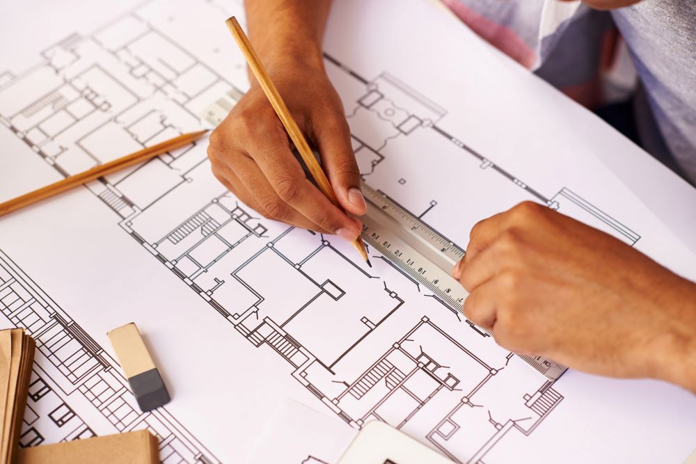 Plans modifiés d'une maison préparés pour un dossier de permis modificatif après un transfert de permis de construire
